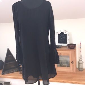 Black mini dress with lace bell sleeves
